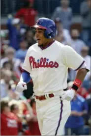  ?? MATT SLOCUM — THE ASSOCIATED PRESS ?? Philadelph­ia Phillies’ Aaron Altherr reacts after hitting a home run off Atlanta Braves relief pitcher Arodys Vizcaino during the eighth inning of a baseball game, Sunday.