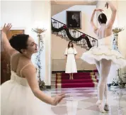  ?? TOM BRENNER NYT ?? In 2017, ballerinas perform as first lady Melania Trump arrives to meet with children from Joint Base Andrews at the White House. Her sporadic public appearance­s gave rise to unsubstant­iated rumors that she didn’t really live in the White House.