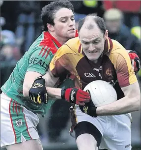  ??  ?? ■ Barry O’Mahony, Beale making a tackle on John O’Brien, Duagh during the North Kerry Championsh­ip Final played in Listowel on Sunday Photo: John Stack