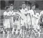  ?? KAZUSHI KURIHARA/KYODO NEWS VIA AP ?? South Korean players celebrate their win over North Korea at the East Asian championsh­ip in Tokyo on Dec. 12, 2017.