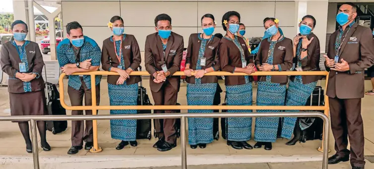  ??  ?? Fiji Airways cabin crew member Andrew Evening (second from left) with fellow crew members.