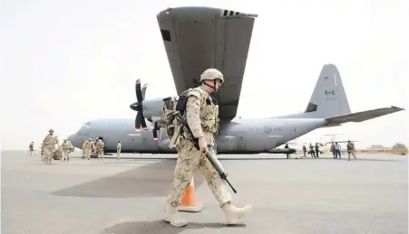  ??  ?? Canadian troops arrive at the UN base in Gao, Mali, on Monday.