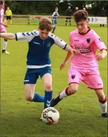  ??  ?? Ronan Geary of Limerick F.C. battles for possession with James Dowling of Wexford F.C. Under-15s in Ramstown,