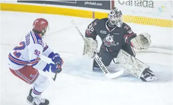  ?? BOB TYMCZYSZYN/STANDARD STAFF ?? Kitchener Rangers Cole Sherwood (92) scores after he was awarded a penalty shot in the first period against the Niagara IceDogs in OHL action Wednesday in St. Catharines.