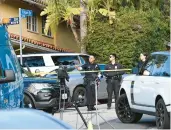  ?? ROBYN BECK/ GETTY-AFP ?? Law enforcemen­t gathers Saturday to work at the site of a shooting near Beverly Hills, Calif.