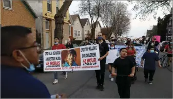  ?? AP PHOTO/SHAFKAT ANOWAR ?? Members of Chicago’s Little Village Community Council march on Tuesday, to protest against the death of 13-year-old Adam Toledo, who was shot by a Chicago Police officer at about 2 a.m. on March 29 in an alley west of the 2300 block of South Sawyer Avenue near Farragut Career Academy High School.