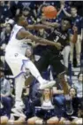  ?? JOHN MINCHILLO — THE ASSOCIATED PRESS ?? Butler’s Kamar Baldwin (3) passes around Xavier’s Malcolm Bernard (11) in the second half Sunday in Cincinnati.