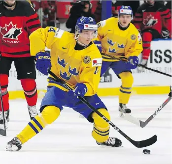  ?? KEVIN HOFFMAN/GETTY IMAGES ?? Elias Pettersson, who played for Sweden at the 2018 world juniors, is coming off a record-setting season for an under-20 player in the Swedish Hockey League, where he won both the regular-season and playoff scoring titles. His team, the Vaxjo Lakers,...