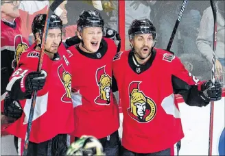  ?? CP PHOTO ?? Ottawa Senators left wing Brady Tkachuk (centre) celebrates his goal with teammates right wing Mark Stone, left, and defenceman Dylan DeMelo as Dallas Stars goaltender Ben Bishop stands in his crease during third period NHL action Monday, in Ottawa