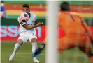  ?? Photograph: Juan Karita/ EPA ?? Lautaro Martínez in action for Argentina against Bolivia. He scored their first goal and set up the second.