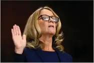  ?? AP PHOTO BY MICHAEL REYNOLDS ?? Christine Blasey Ford is sworn in before the Senate Judiciary Committee, Thursday, Sept. 27, on Capitol Hill in Washington.