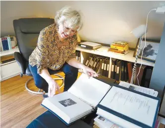  ?? The San Diego Union-Tribune-Tribune News Service ?? Kathi Diamant looks through materials she’s collected for the Kafka Project.