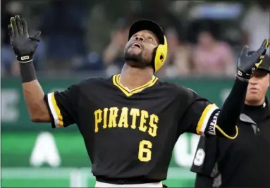  ?? GENE J. PUSKAR — THE ASSOCIATED PRESS ?? Pittsburgh Pirates’ Starling Marte stands on second after driving in a run with an RBI double off Philadelph­ia Phillies starting pitcher Zach Eflin during the third inning of a baseball game in Pittsburgh, Saturday.
