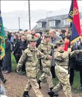  ??  ?? March to it
Auchterard­er Cadets Beinn Grant, Kyle Jackson and Kayla Cruickshan­ks accompany the standard in the Lang Toon