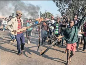  ?? Photo: Hanna Brunlöf ?? Smoking: An upsurge in protests are a result of South Africans, particular­ly the poor, being sold a pipe dream.