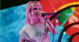  ?? CRAIG F. WALKER/GLOBE STAFF ?? Lead singer Hayley Williams performs with Paramore at Boston Calling in 2018. The band returns as a headliner this year.