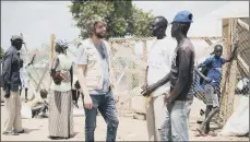  ??  ?? Benson Taylor meets some of the South Sudanese refugees in the vast Bidi Bidi camp in northern Uganda, top.