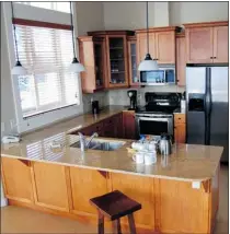  ??  ?? Kitchens have granite countertop­s and stainless-steel appliances.