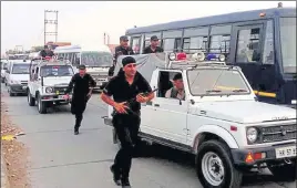  ?? MANOJ DHAKA/HT ?? Security forces during a flag march in Sirsa on Monday.