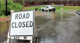  ?? Olivia Morley ?? Public Works closed Brewer Road on Wednesday afternoon after the creek rose and flooded part of the road leading to Fulton Road.