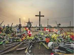  ?? LEAH HENNEL ?? A memorial stands where 16 members of the Humboldt Broncos hockey team were killed in a bus crash near Tisdale last April.
