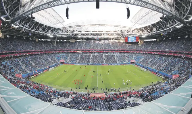  ?? Picture: Reuters ?? THUMBS-UP. Despite glitches with the St Petersburg Stadium’s pitch (above) and heavy traffic, Russia passed the Confederat­ions Cup test with flying colours.