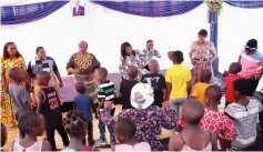  ?? ?? First Lady Dr Auxillia Mnangagwa and members of the committee she formed to help counsel the children who were filmed taking alcohol on Christmas Day in Harare and at Juru growth point join the children on the dance floor at Zimbabwe House yesterday