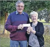  ?? ?? President of FADAMS Ross Whitaker presented a cheque to Finley School of Arts Secretary Jan Gray to cover the cost of a new dishwasher at the hall.