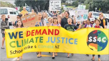  ?? PICTURE / PETER DE GRAAF ?? Russell School pupils march through the town calling for climate action.