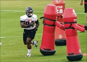  ?? JOHN BAZEMORE / AP ?? Third-year defensive tackle Deadrin Senat (94) was mostly inactive last season, as he played in two games. The drafting of DT Marlon Davidson in the second round likely forces Senat to compete for one open spot.