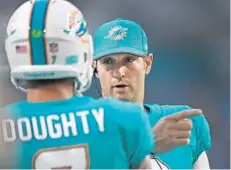  ?? JIM RASSOL/STAFF PHOTOGRAPH­ER ?? Coach Adam Gase was pleased with Jay Cutler’s first outing as a Dolphin despite only getting one first down with the first-team offense on Thursday.