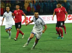  ??  ?? ISRAEL CAPTAIN Eran Zahavi celebrates after scoring the opener in last night’s win at Albania in 2018 World Cup qualificat­ion.