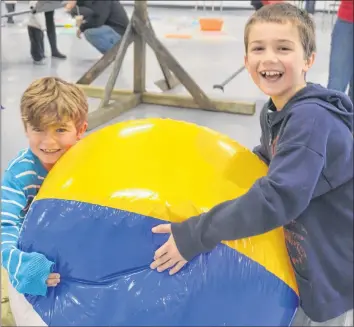  ?? KIRK STARRATT ?? Eight-year-old Garrett and nine-year-old Gavin Bird of Kingston had a blast playing with a beach ball at the Kentville Plays anniversar­y event.