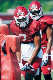  ?? NWA Democrat-Gazette File Photo/ANDY SHUPE ?? Arkansas receiver Trey Knox (left) lines up Aug. 6 during practice at the university practice field. Knox took a hard hit late in the fourth quarter against Ole Miss on Saturday.