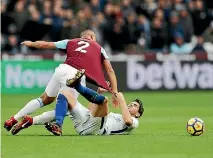  ?? PHOTOS: GETTY IMAGES ?? Winston Reid of West Ham United and Alvaro Morata of Chelsea battle for possession in West Ham’s 1-0 win.