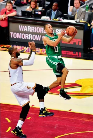  ?? AFP ?? Avery Bradley (right) of the Celtics goes up against LeBron James of the Cavaliers during Game Three of the Eastern Conference Finals in Cleveland, Ohio. —
