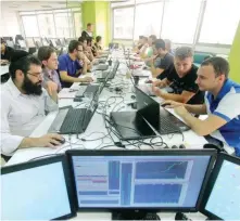  ?? (Simple Trade) ?? A HAREDI man works as a stock trader in a shared workspace in Ramat Gan.