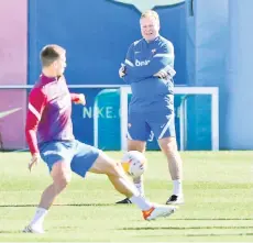  ?? — AFP photo ?? Barcelona’s coach Koeman heads a training session at the Joan Gamper training ground in Sant Joan Despi.