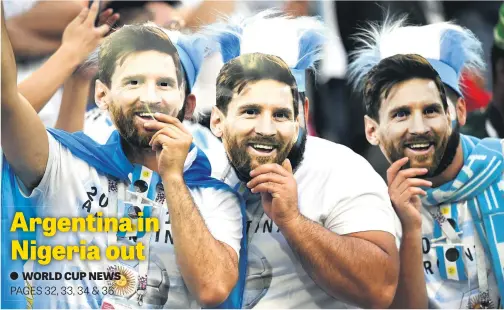  ?? Picture: AFP ?? Argentina supporters wearing masks bearing the face of forward Lionel Messi at the World Cup Group D match against Nigeria at the St Petersburg Stadium in Russia last night. Argentina beat Nigeria 2-1 to advance to the last-16.
