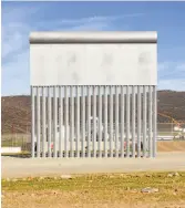  ?? Daniel Ochoa de Olza / Associated Press ?? A border wall prototype stands in San Diego near the U.S. border with Mexico, seen from Tijuana.