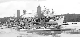  ??  ?? San Juan Fiesta leading boat carrying the statue of San Juan with smallers boats accompanyi­ng during the float parade from Poruk San Juan to Timan beach and later turned back to Lamao Port and passby Bay Bay town beach and returned back to Poruk San...