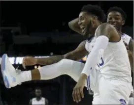  ?? ORLIN WAGNER — THE ASSOCIATED PRESS ?? Seton Hall’s Myles Powell, front, celebratin­g in the NCAA tourney last March, was celebratin­g a win over Rutgers on Saturday.