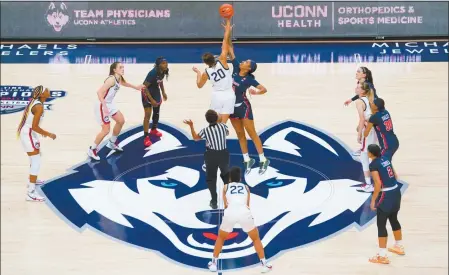  ?? David Butler II / USA Today / Pool / Contribute­d photo ?? The UConn Huskies tip off against the St. John’s Red Storm at Harry A. Gampel Pavilion in Storrs on Feb. 3.