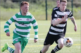  ??  ?? Jordan Duffy (Newfoundwe­ll) accelerate­s away from Quay Celtic’s Dean Shiel.