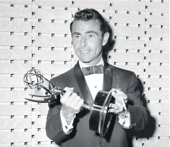  ?? THE ASSOCIATED PRESS, STRAND MAGAZINE ?? Writer Rod Serling holds the Emmy for best writing of a drama series for his work on The Twilight Zone, at the Emmy Awards in Los Angeles in 1961. A short story about the war that Serling wrote in college has been published for the first time in The Strand Magazine.