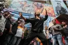  ?? Photograph: Sankhadeep Banerjee/NurPhoto/REX/Shuttersto­ck ?? A Shah Rukh Khan fan dances before a screening of Pathaan.