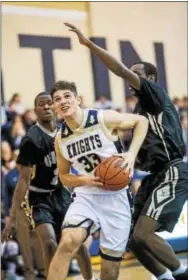  ?? NATE HECKENBERG­ER — FOR DIGITAL FIRST MEDIA ?? West Chester Rustin’s Jake Nelson blocks a shot by Glen Mills’ Kenyon Cooper and drives past Glen Mills’ Myron Sanders, while Chris McMahon tries to block a shot by the Bulls’ Rueben Savilai duiring Tuesday’s District 1 playoff game.