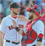  ?? STAFF PHOTO BY NANCY LANE ?? STILL GOING STRONG: Catcher Sandy Leon (right) is 16-for-35 with nine RBI after another good game.