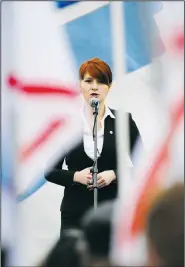  ?? AP File Photo ?? Maria Butina, leader of a pro-gun organizati­on in Russia, speaks to a crowd April 21, 2013, during a rally in support of legalizing the possession of handguns in Moscow.