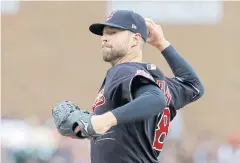  ?? AP ?? Indians starting pitcher Corey Kluber throws against the Tigers.